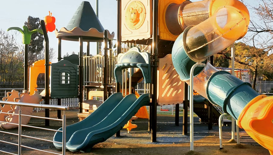 Kids playing on jungle gym at The Play Date